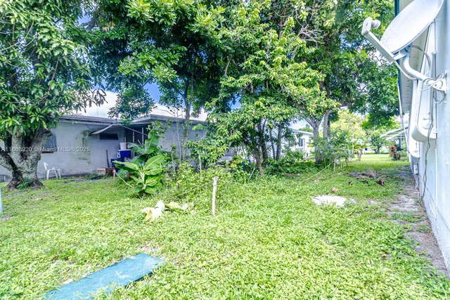 a backyard of a house with lots of green space