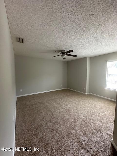 3790 Pondview Street Orange Park, FL 32065 - Photo 7 of 26 an empty room with windows and fan