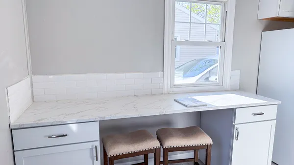 a hallway with a sink and a window