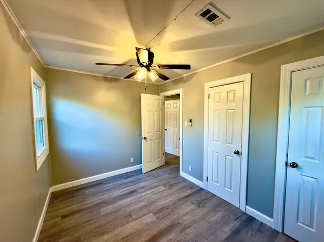 a view of entryway with wooden floor