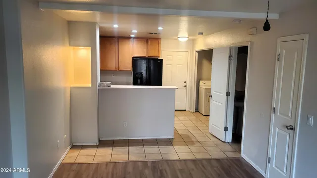 a view of a kitchen from the hallway