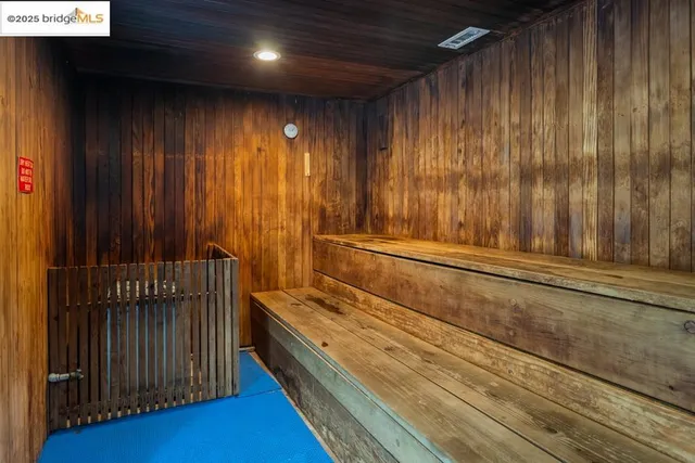 a view of a room with furniture and wooden floor