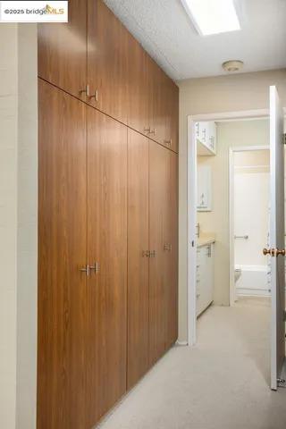 a bathroom with a shower and a glass door