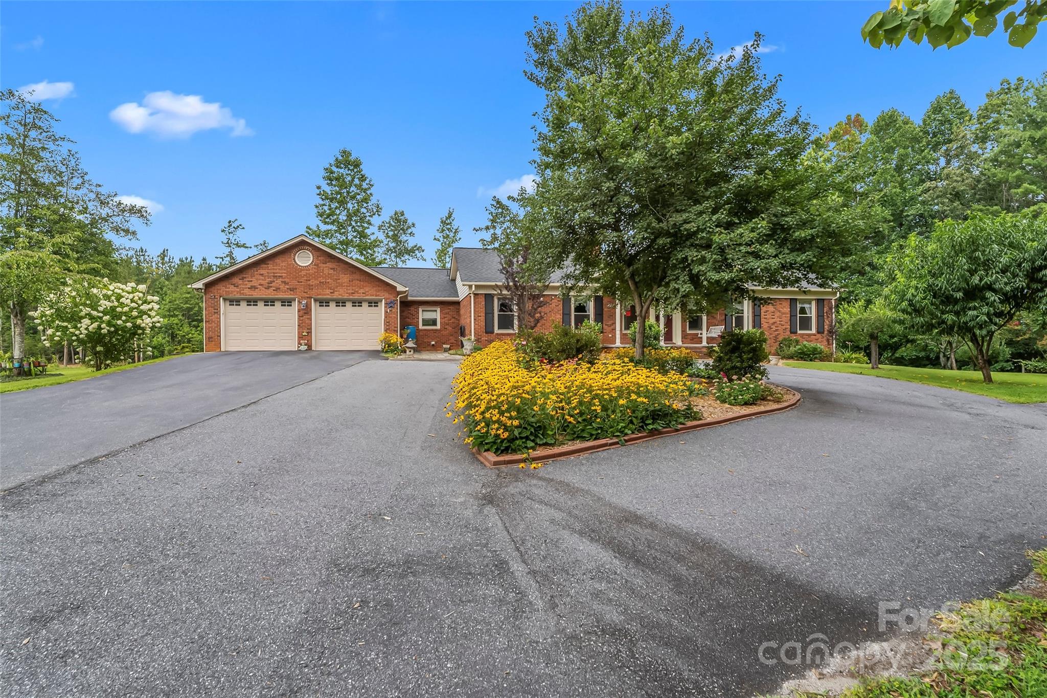 2423 Warrior Fork Trail Morganton, NC 28655 - Photo 2 of 42 a view of a house with porch and garden