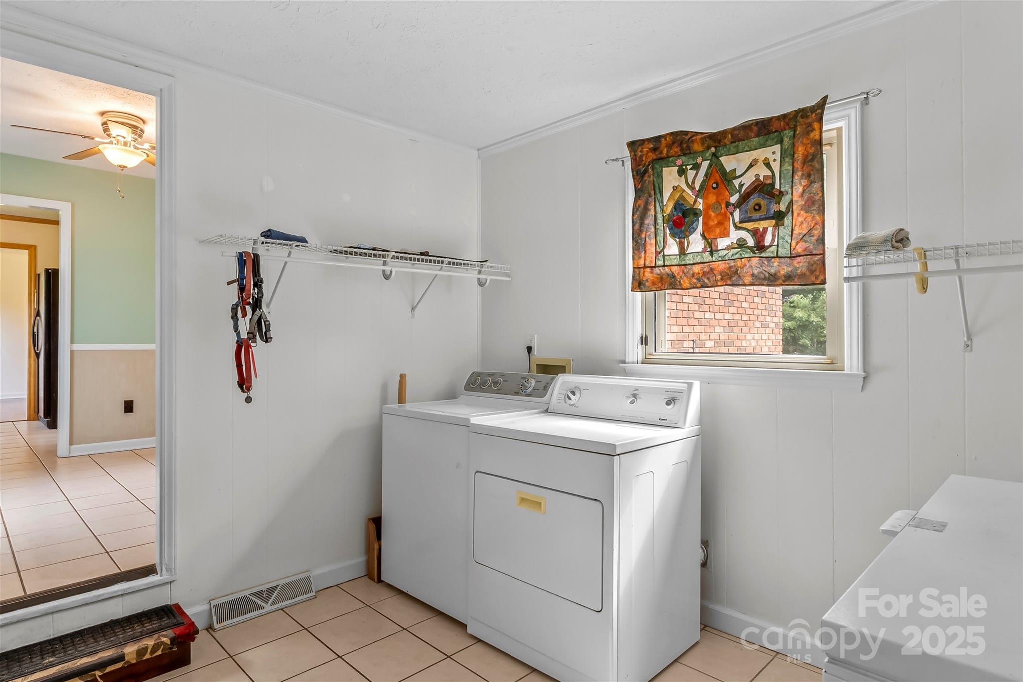 2423 Warrior Fork Trail Morganton, NC 28655 - Photo 25 of 42 a utility room with a window dryer and washer