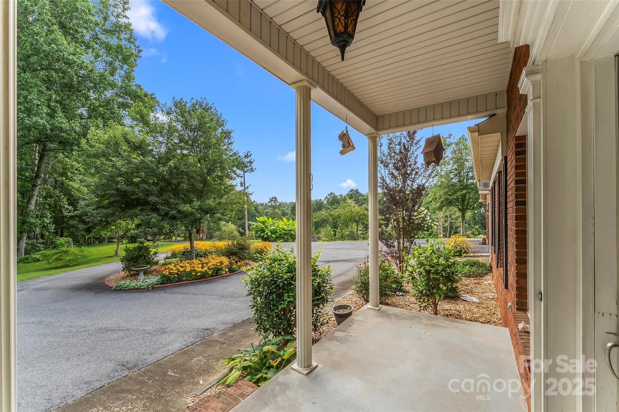 2423 Warrior Fork Trail Morganton, NC 28655 - Photo 3 of 42 a front view of a house with garden