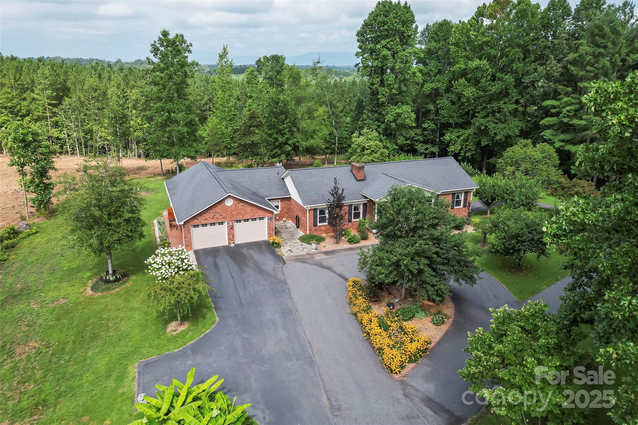 2423 Warrior Fork Trail Morganton, NC 28655 - Photo 35 of 42 an aerial view of a house with a garden