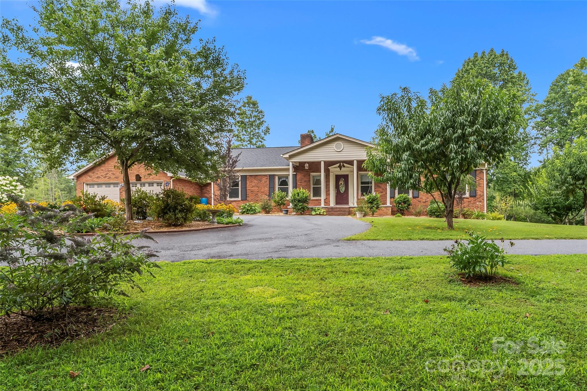 2423 Warrior Fork Trail Morganton, NC 28655 - Photo 41 of 42 a view of house in front of a big yard with large trees