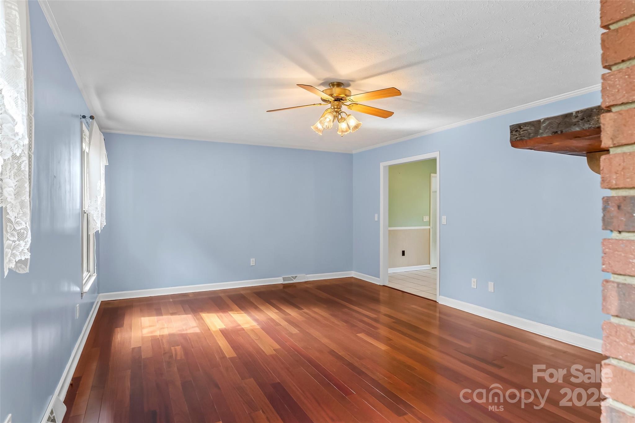 2423 Warrior Fork Trail Morganton, NC 28655 - Photo 10 of 42 wooden floor in an empty room with a window