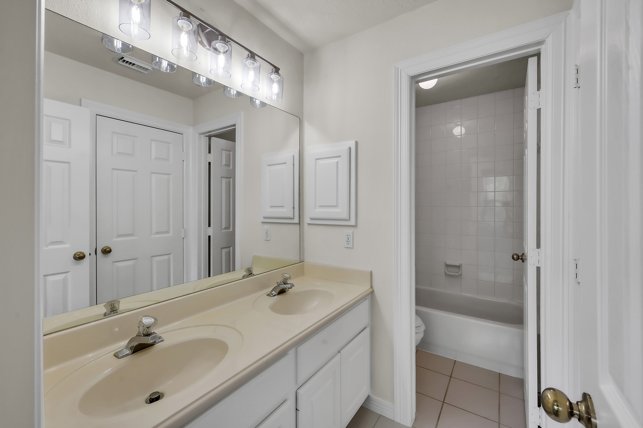 18310 Rittenhouse Park Court Spring, TX 77379 - Photo 24 of 35 Secondary bathroom upstairs with fresh paint and new light fixture.