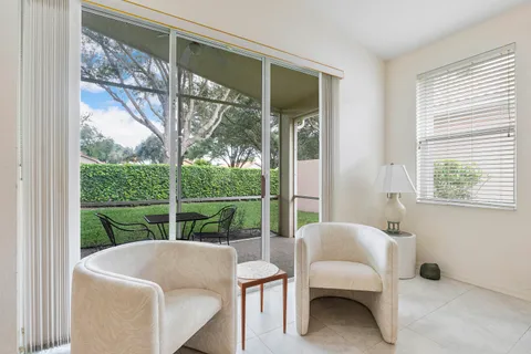 a living room with couch and a window