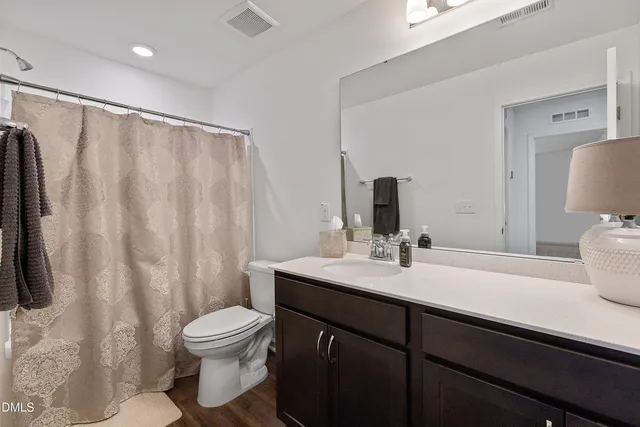 a bedroom with a bed and a cabinets