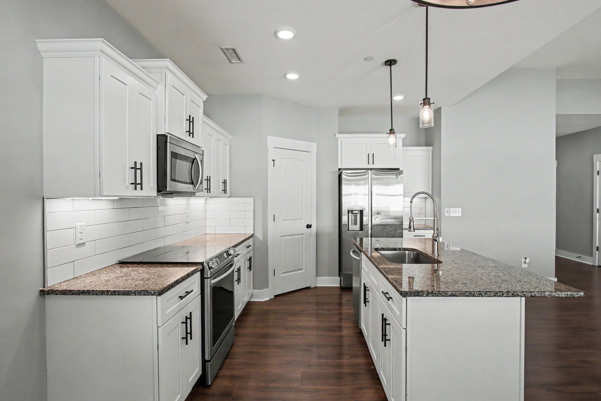 7208 Winding Way Pleasant View, TN 37146 - Photo 10 of 30 a kitchen with stainless steel appliances granite countertop a sink stove and refrigerator