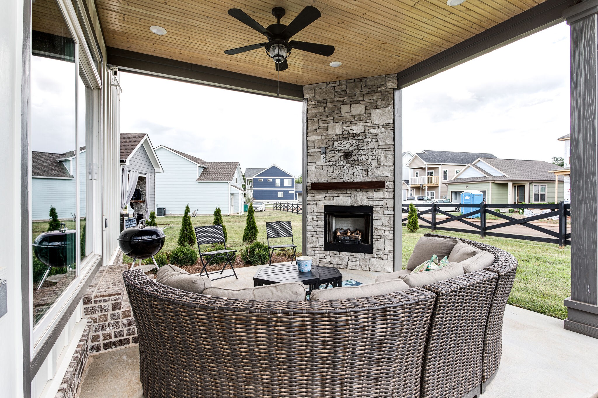 111 Barefoot Way Winchester, TN 37398 - Photo 29 of 33 a living room with furniture a fireplace and a floor to ceiling window