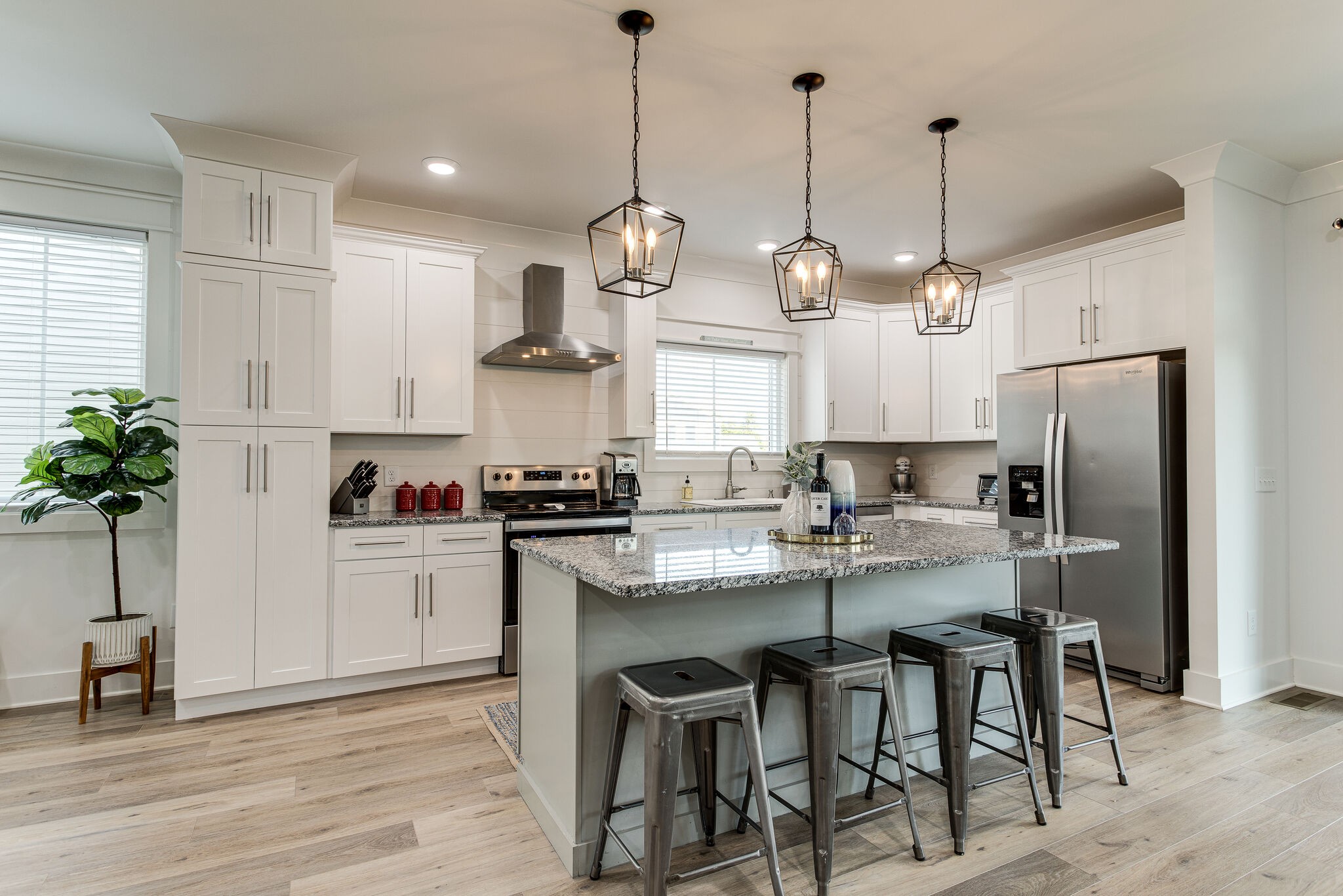 111 Barefoot Way Winchester, TN 37398 - Photo 8 of 33 a kitchen with stainless steel appliances kitchen island granite countertop a table chairs and white cabinets