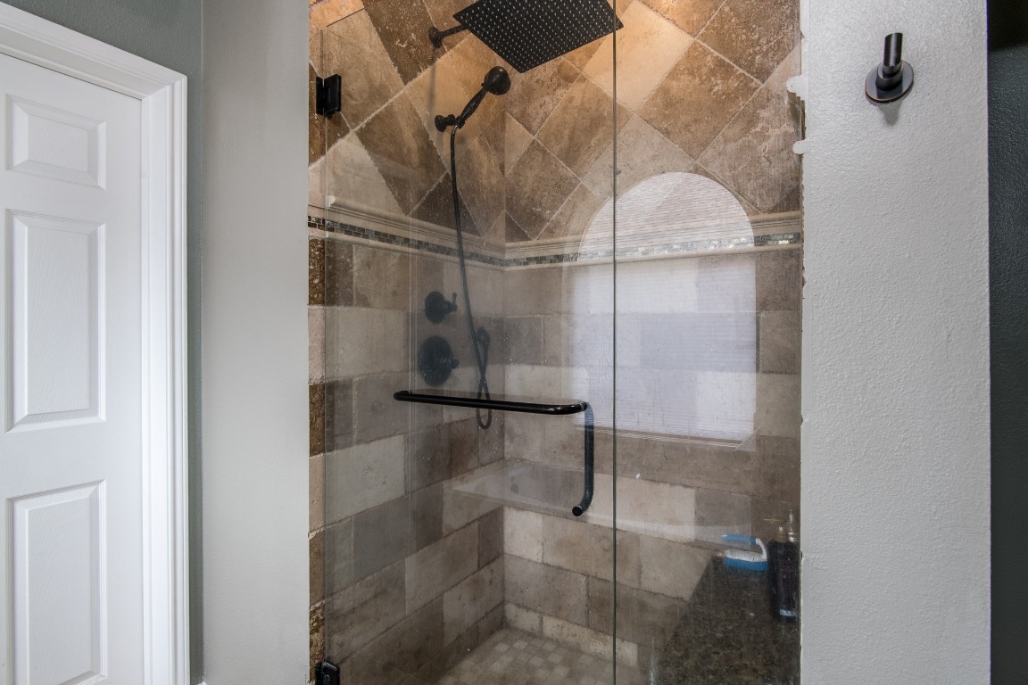 20011 Castlegreen Drive Spring, TX 77388 - Photo 21 of 32 Updated shower with travertine surround and seat.