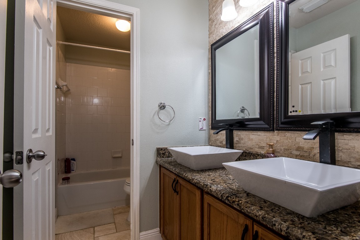 20011 Castlegreen Drive Spring, TX 77388 - Photo 26 of 32 Updated second full bath with 2 sinks for easy morning prep!