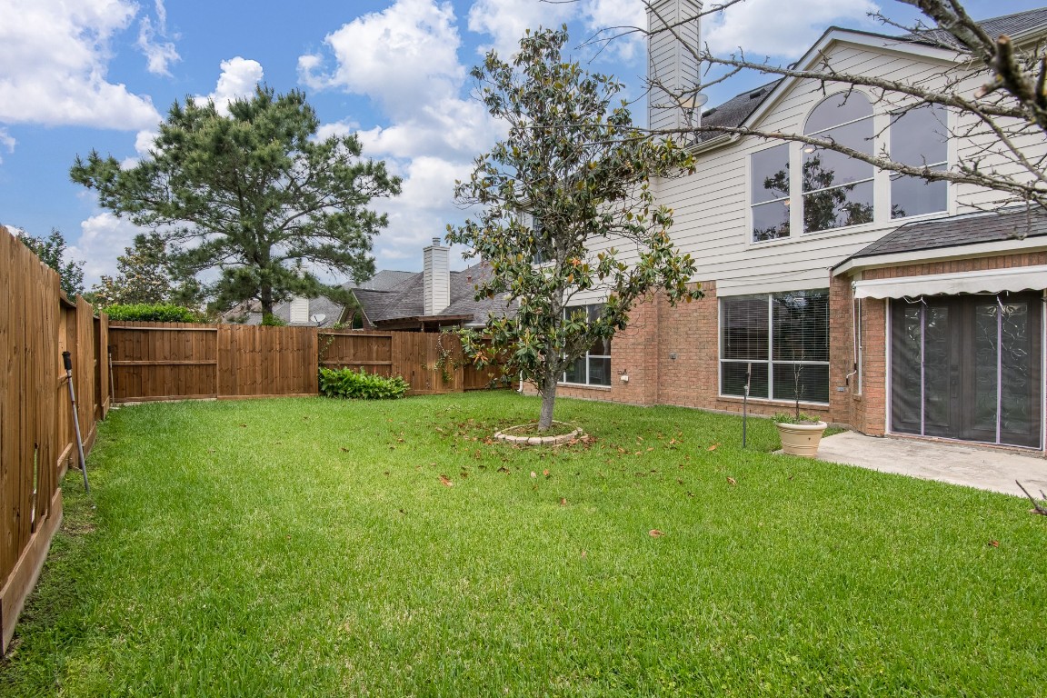 20011 Castlegreen Drive Spring, TX 77388 - Photo 28 of 32 Great sized backyard with sprinklers.