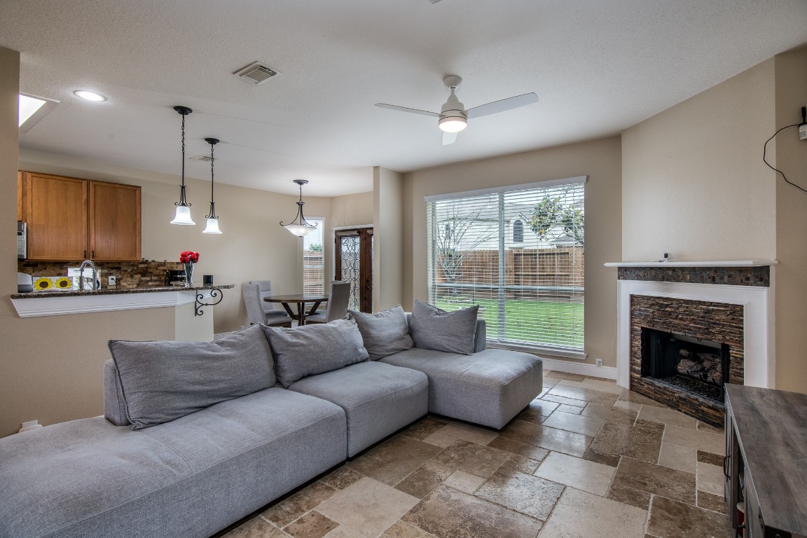20011 Castlegreen Drive Spring, TX 77388 - Photo 7 of 32 Family room is anchored by an updated gas fireplace.