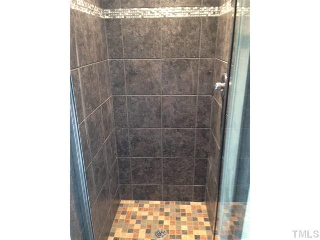 2728 Shepherd Valley Street Raleigh, NC 27610 - Photo 12 of 15 a bathroom with a shower