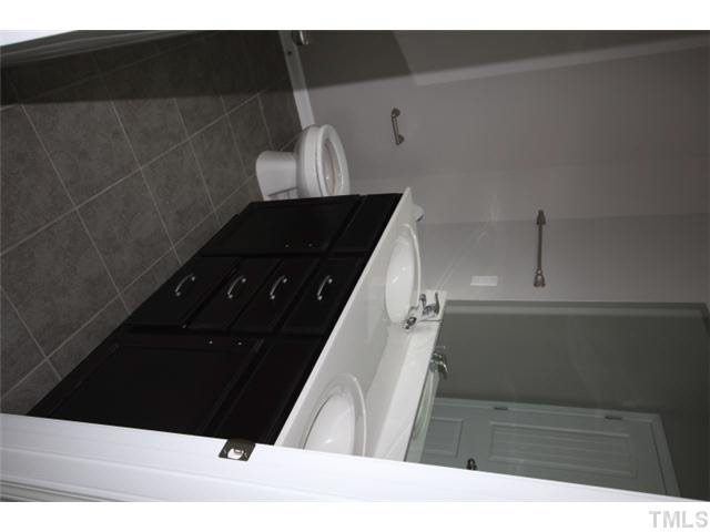 2728 Shepherd Valley Street Raleigh, NC 27610 - Photo 15 of 15 a black and white photo of a shower
