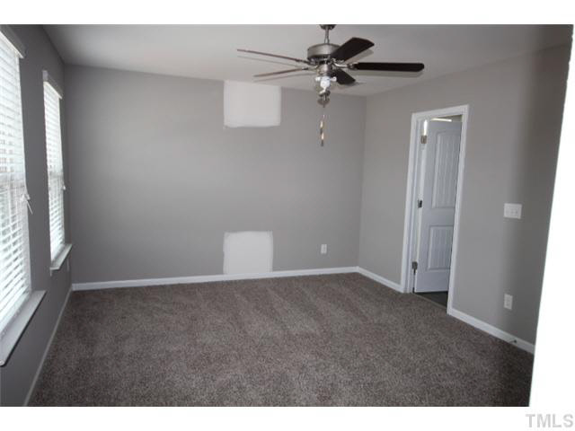 2728 Shepherd Valley Street Raleigh, NC 27610 - Photo 10 of 15 a view of an empty room with a window