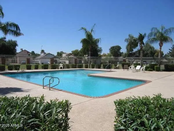 a view of a swimming pool with a lake view