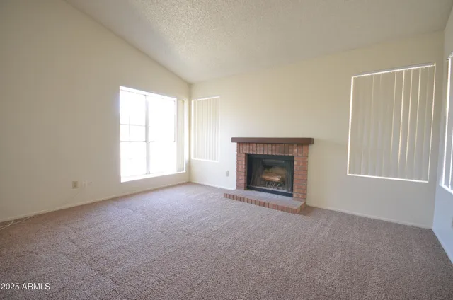 an empty room with a fireplace
