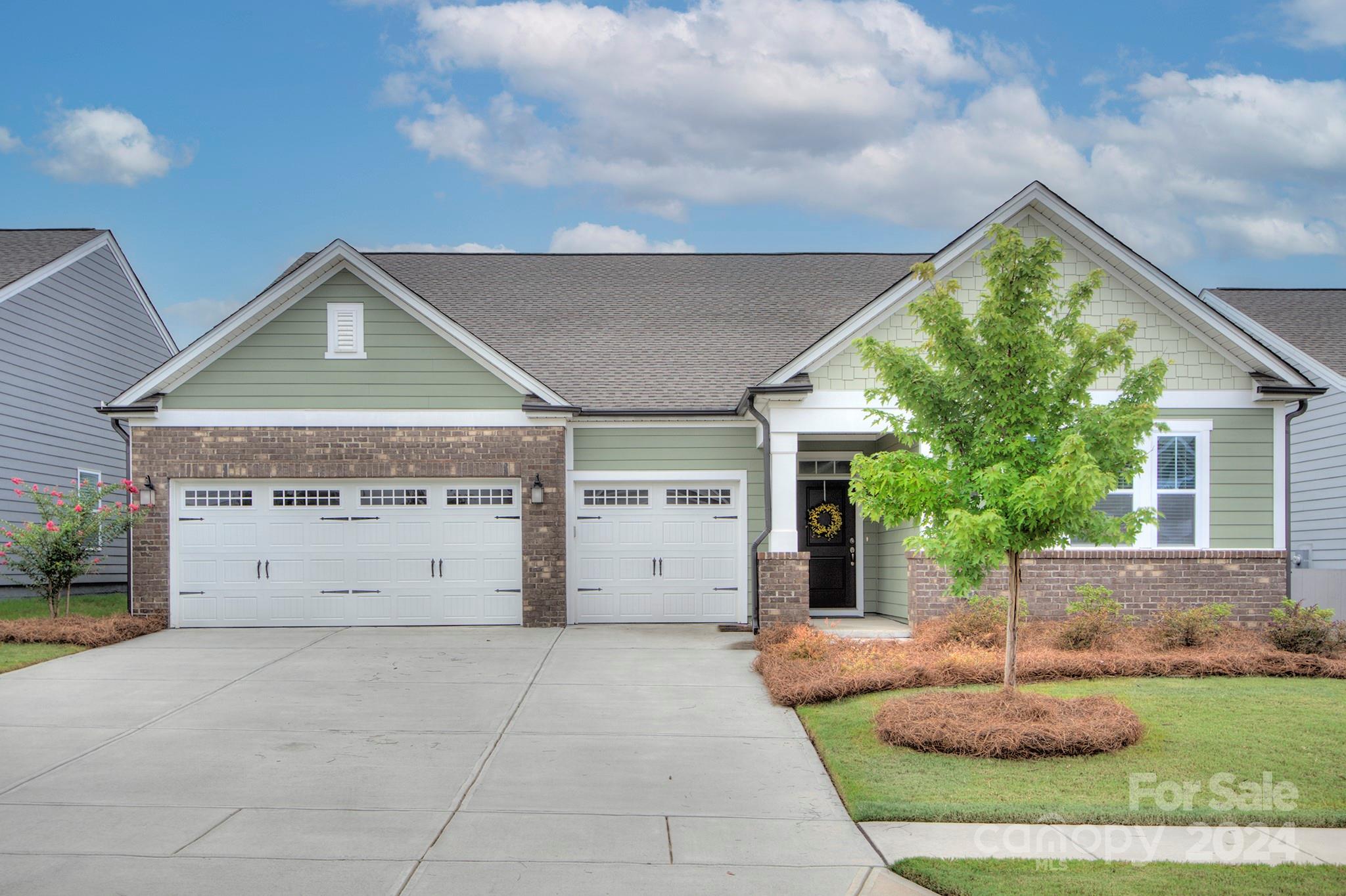 7047 Messina Road Fort Mill, SC 29707 - Photo 2 of 32 a front view of a house with garden