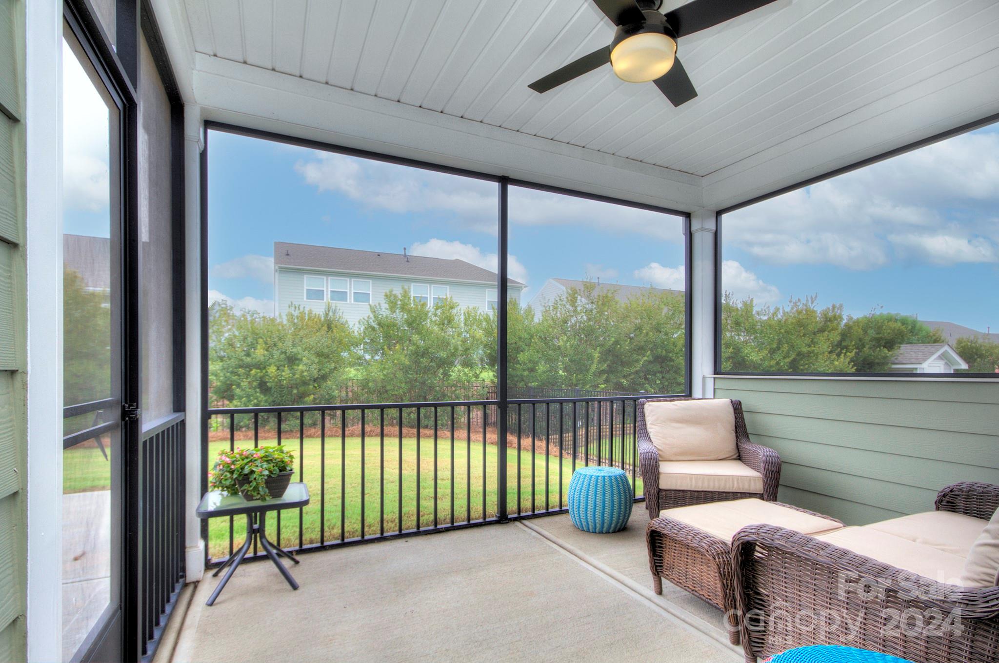 7047 Messina Road Fort Mill, SC 29707 - Photo 3 of 32 a living room with furniture and a floor to ceiling window