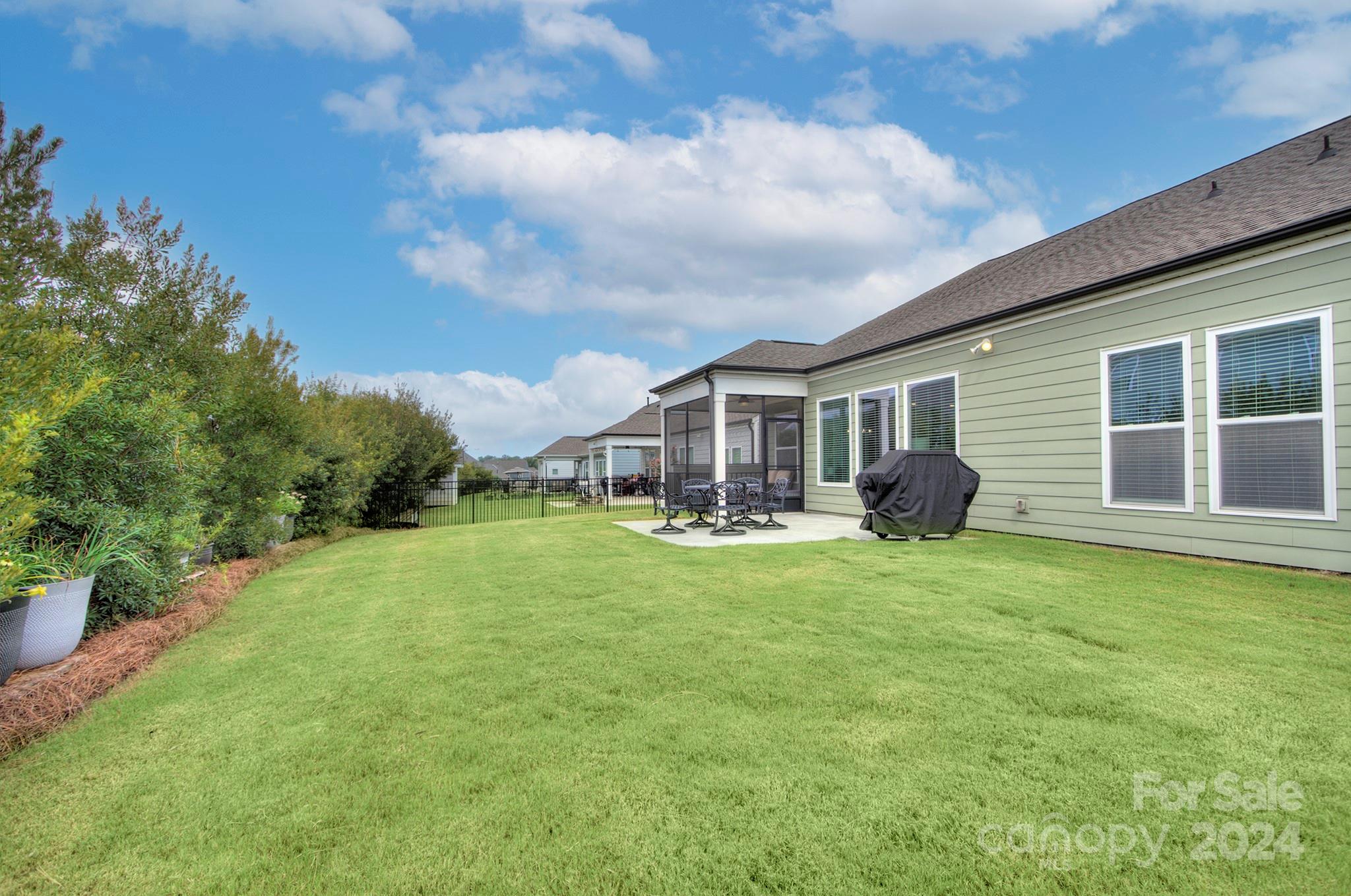 7047 Messina Road Fort Mill, SC 29707 - Photo 5 of 32 a front view of a house with yard patio and green space