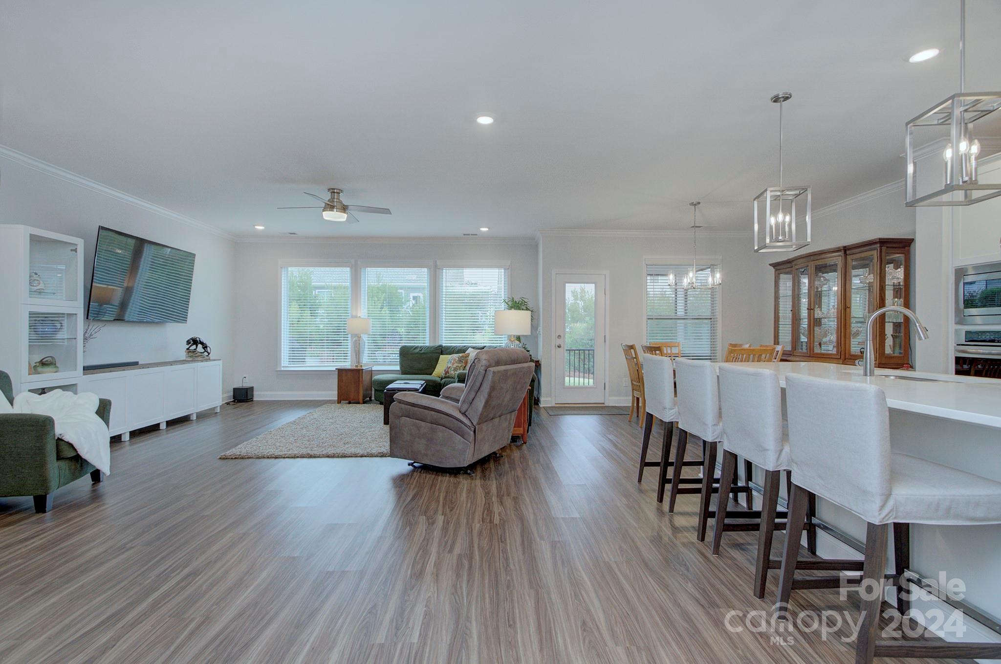7047 Messina Road Fort Mill, SC 29707 - Photo 6 of 32 a living room with furniture wooden floor and a large window