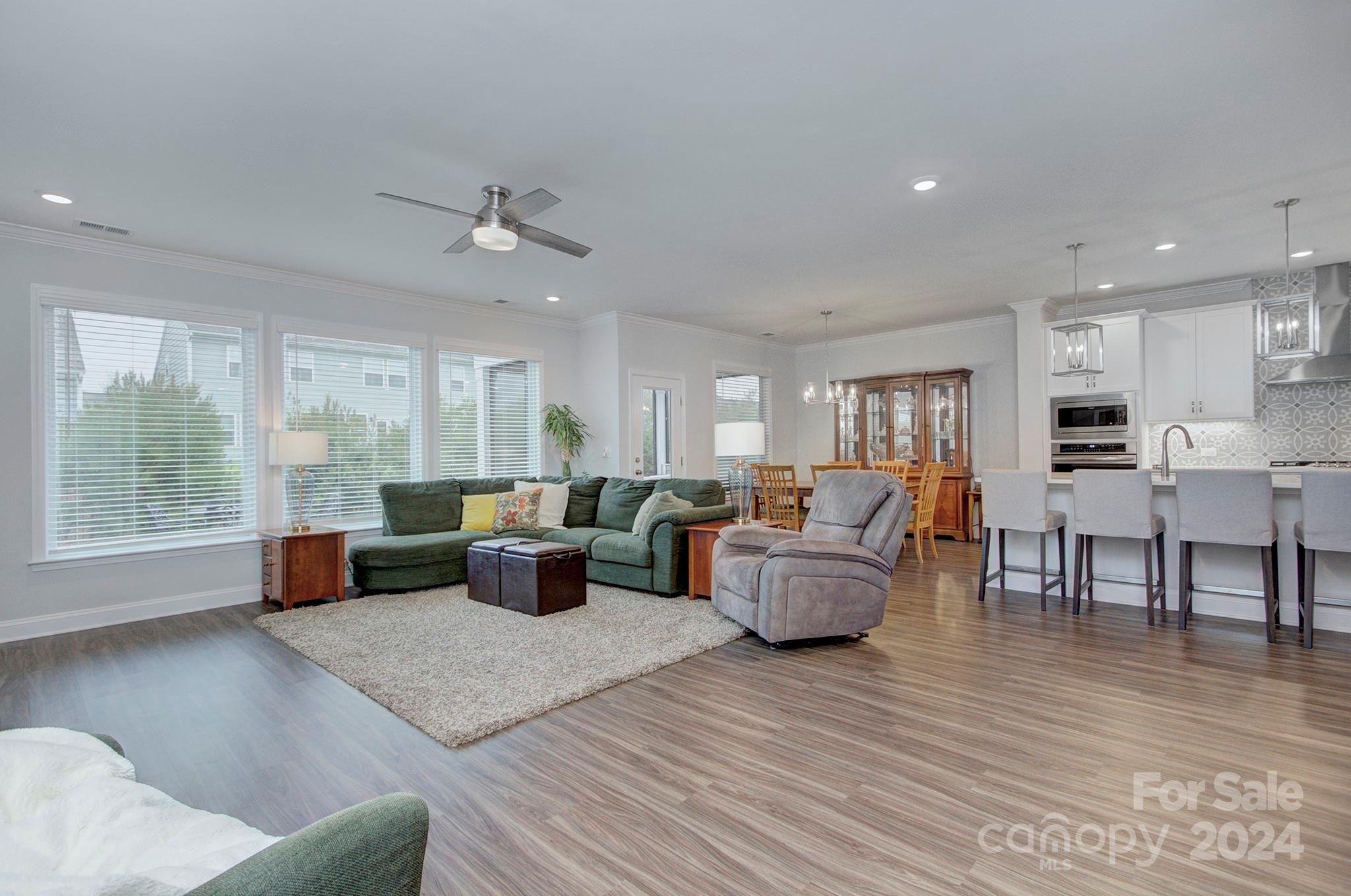 7047 Messina Road Fort Mill, SC 29707 - Photo 7 of 32 a living room with furniture and wooden floor