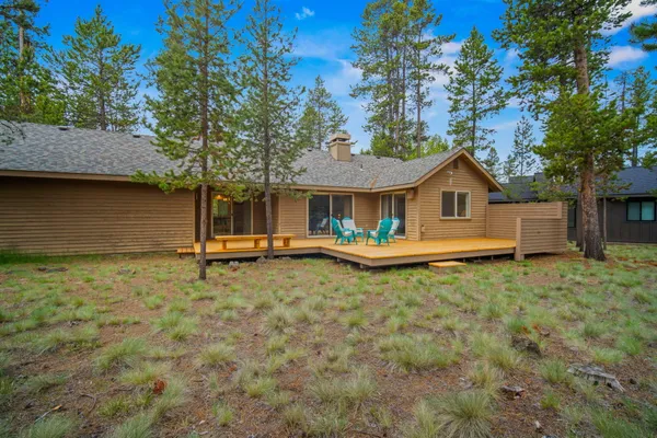 a house with trees in the background