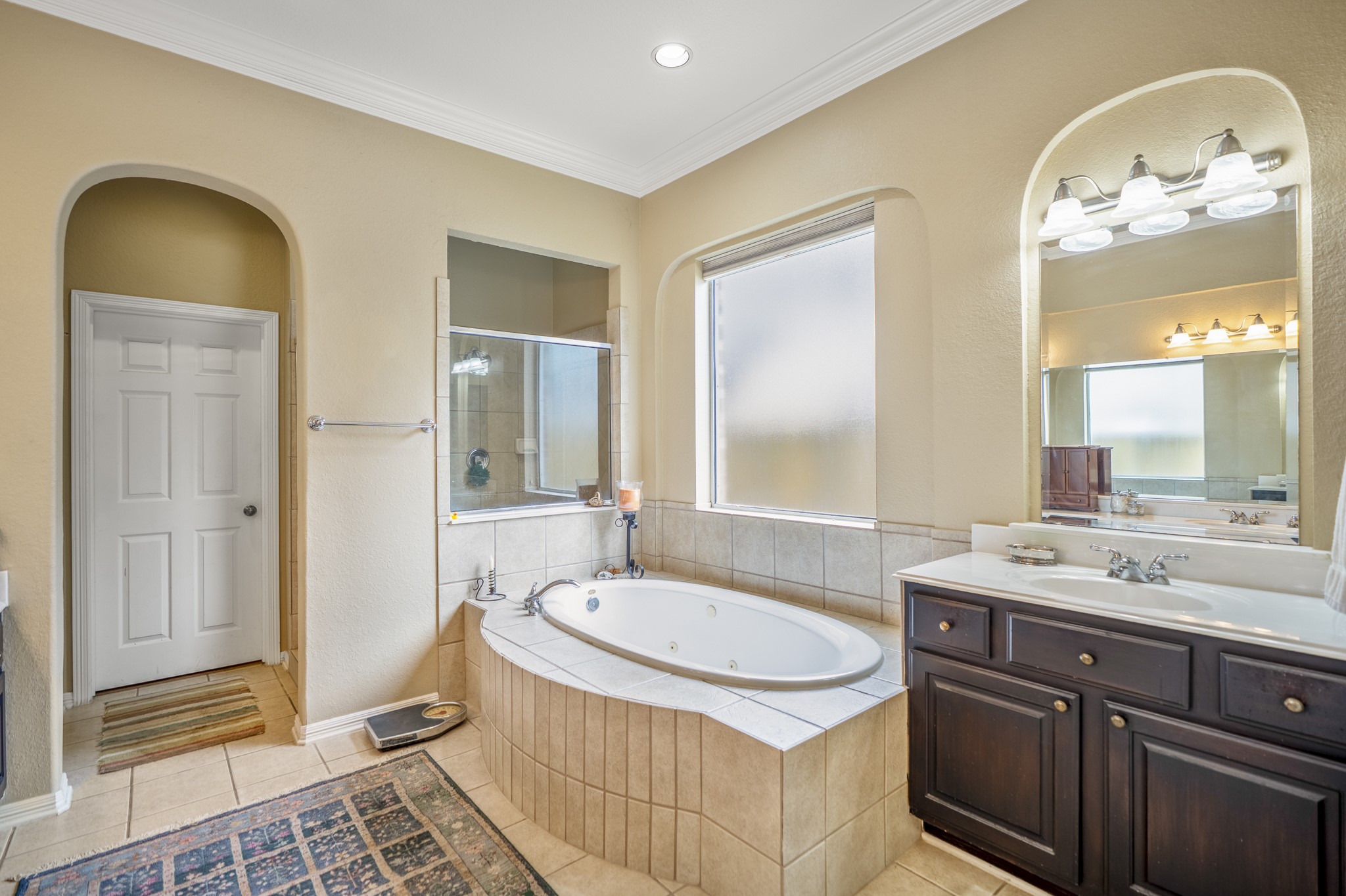 1438 Hatchmere Place Spring, TX 77379 - Photo 21 of 50 There is a large window above the tub, offering plenty of natural lighting, there is overhead and task lighting in the bathroom.