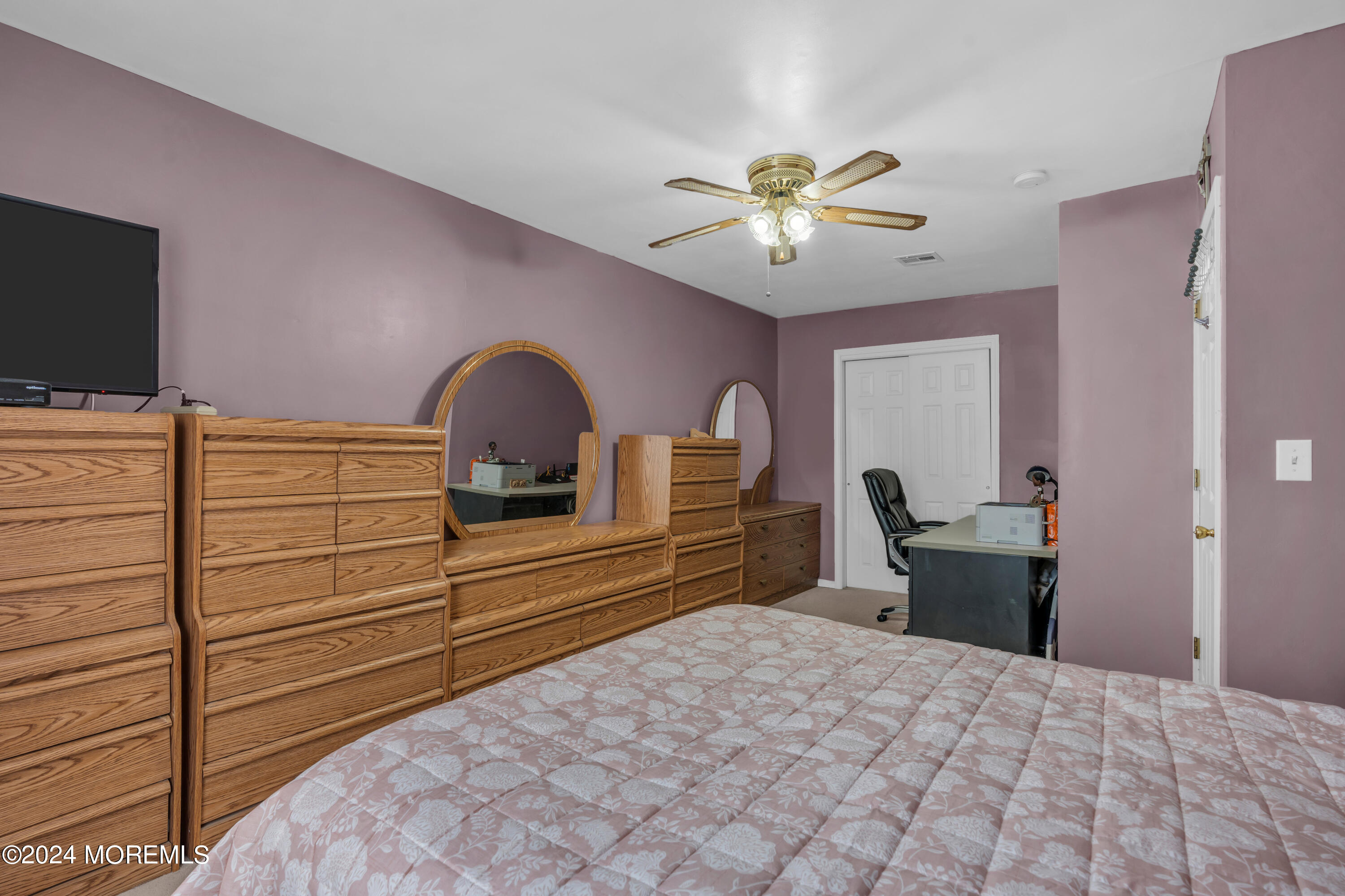 415 Union Avenue Union Beach, NJ 07735 - Photo 12 of 17 a bedroom with a bed and a flat screen tv