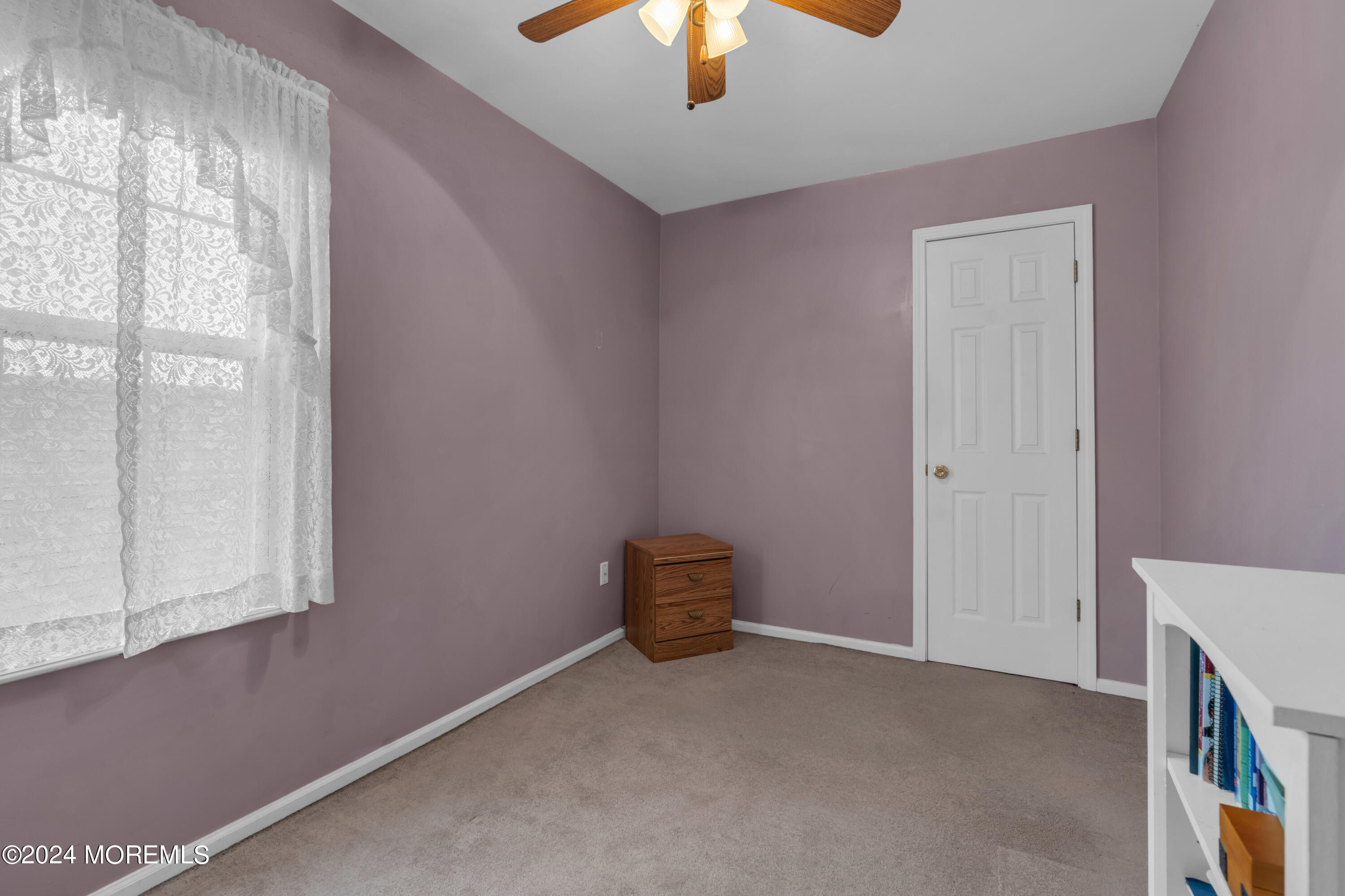 415 Union Avenue Union Beach, NJ 07735 - Photo 15 of 17 a view of an empty room and chandelier fan