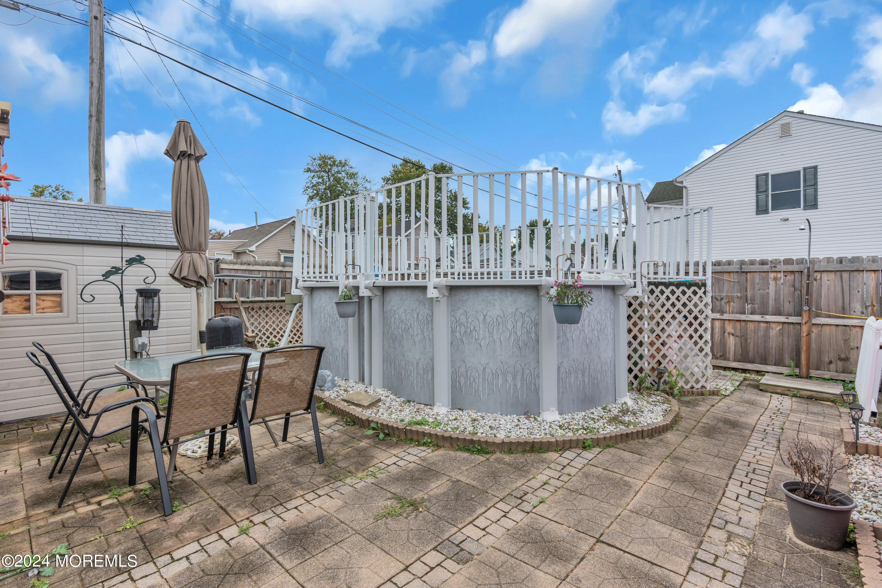 415 Union Avenue Union Beach, NJ 07735 - Photo 16 of 17 a view of a patio with table and chairs