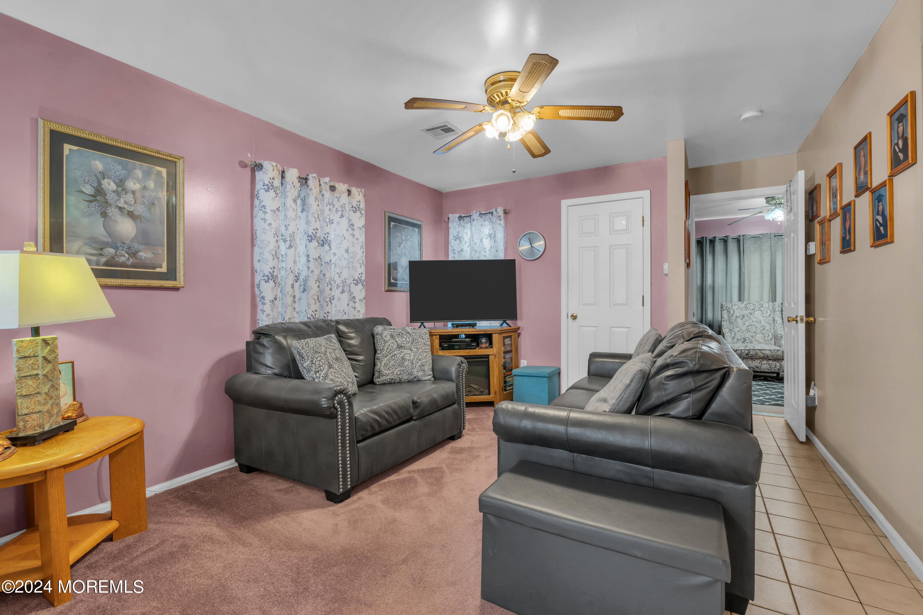 415 Union Avenue Union Beach, NJ 07735 - Photo 3 of 17 a living room with furniture and a flat screen tv