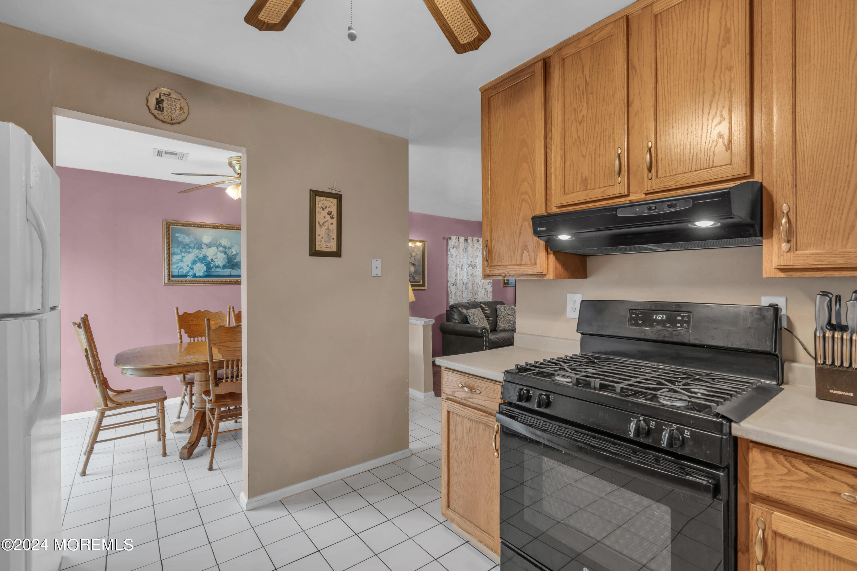 415 Union Avenue Union Beach, NJ 07735 - Photo 7 of 17 a kitchen with granite countertop a stove and a refrigerator