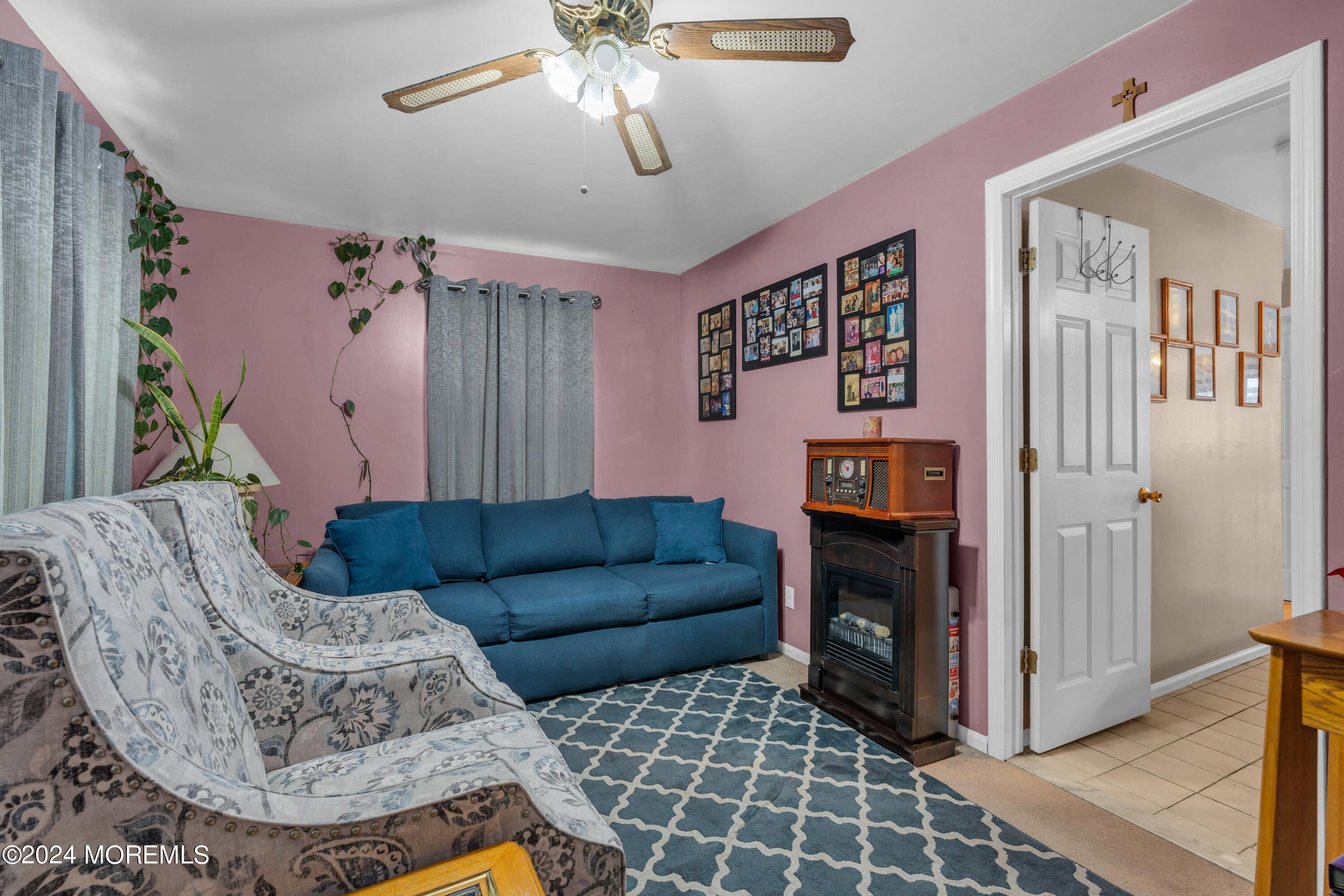415 Union Avenue Union Beach, NJ 07735 - Photo 9 of 17 a living room with furniture and a fireplace