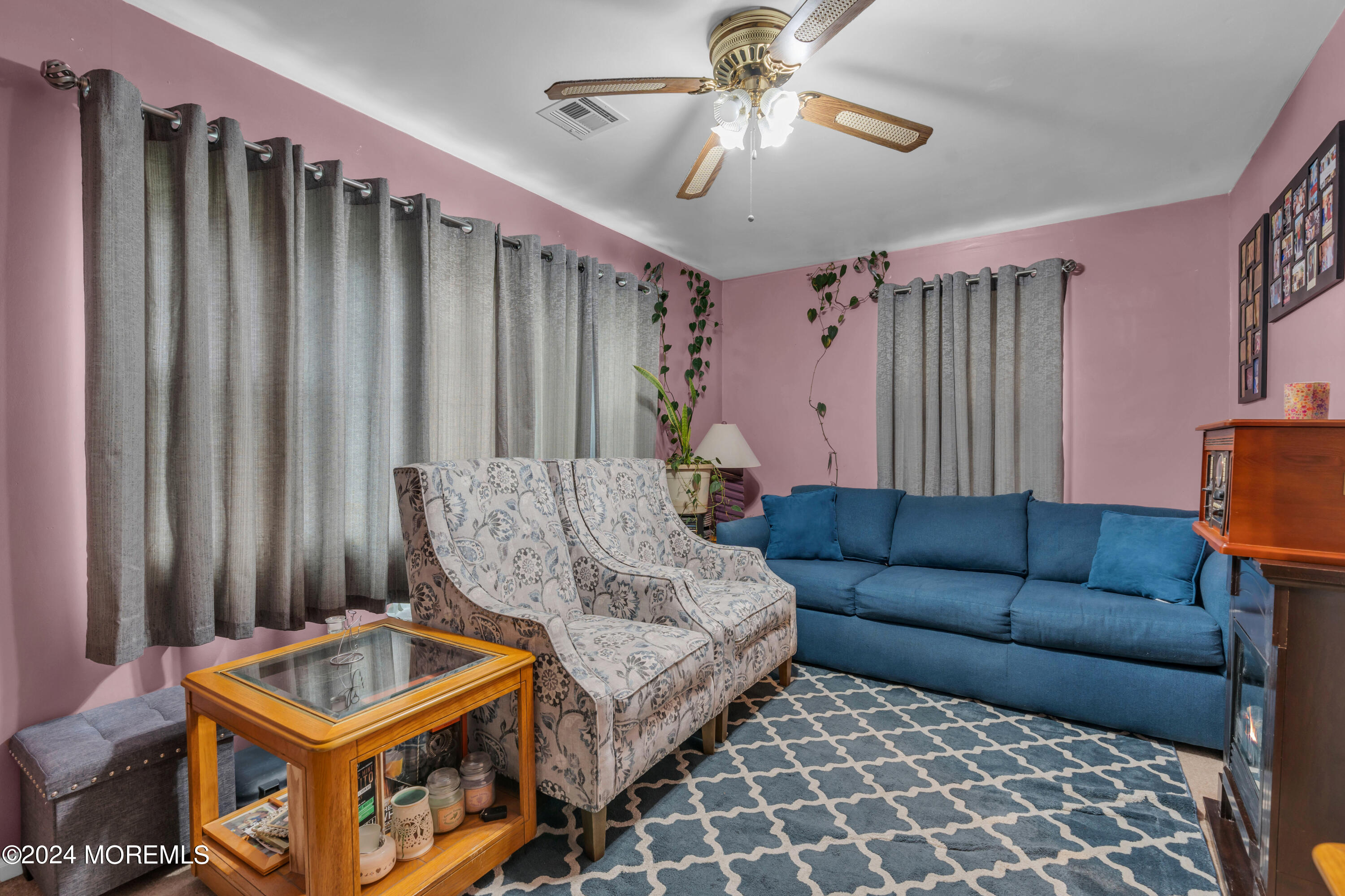 415 Union Avenue Union Beach, NJ 07735 - Photo 10 of 17 a living room with furniture and a chandelier