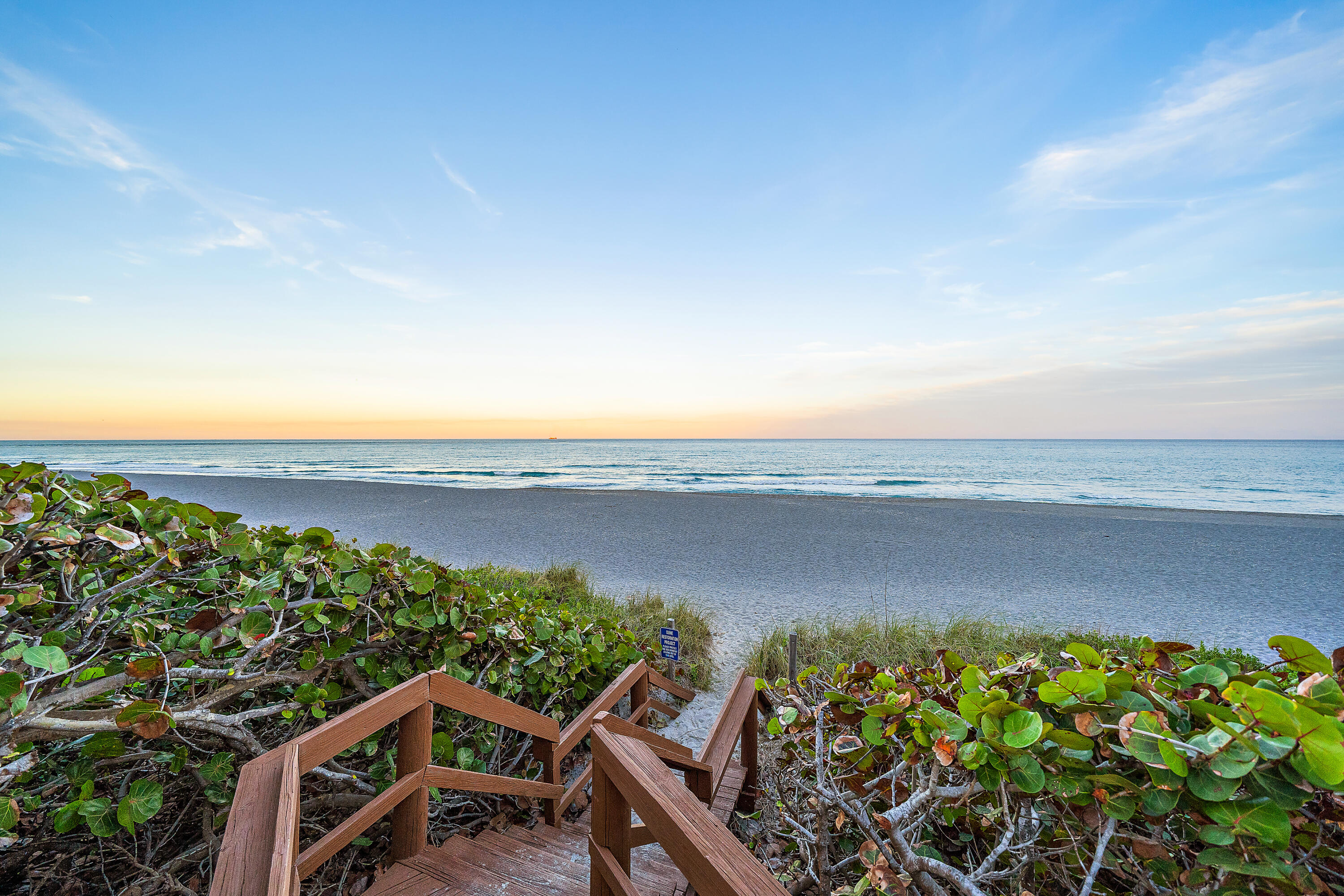 300 Ocean Trail Way, Unit 102 Jupiter, FL 33477 - Photo 1 of 30 a view of a lake with a mountain in the background