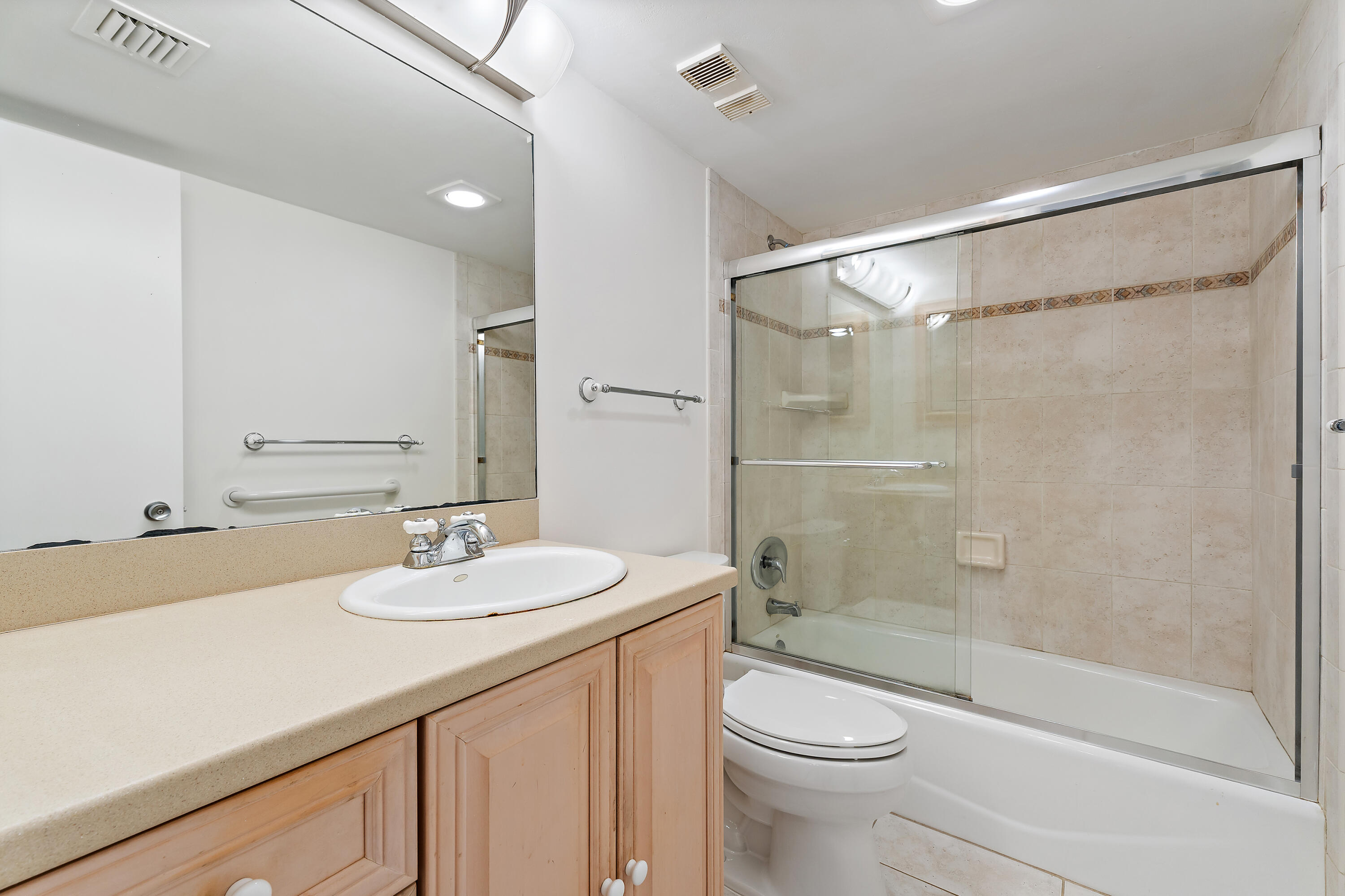 300 Ocean Trail Way, Unit 102 Jupiter, FL 33477 - Photo 20 of 30 a bathroom with a sink a toilet and shower