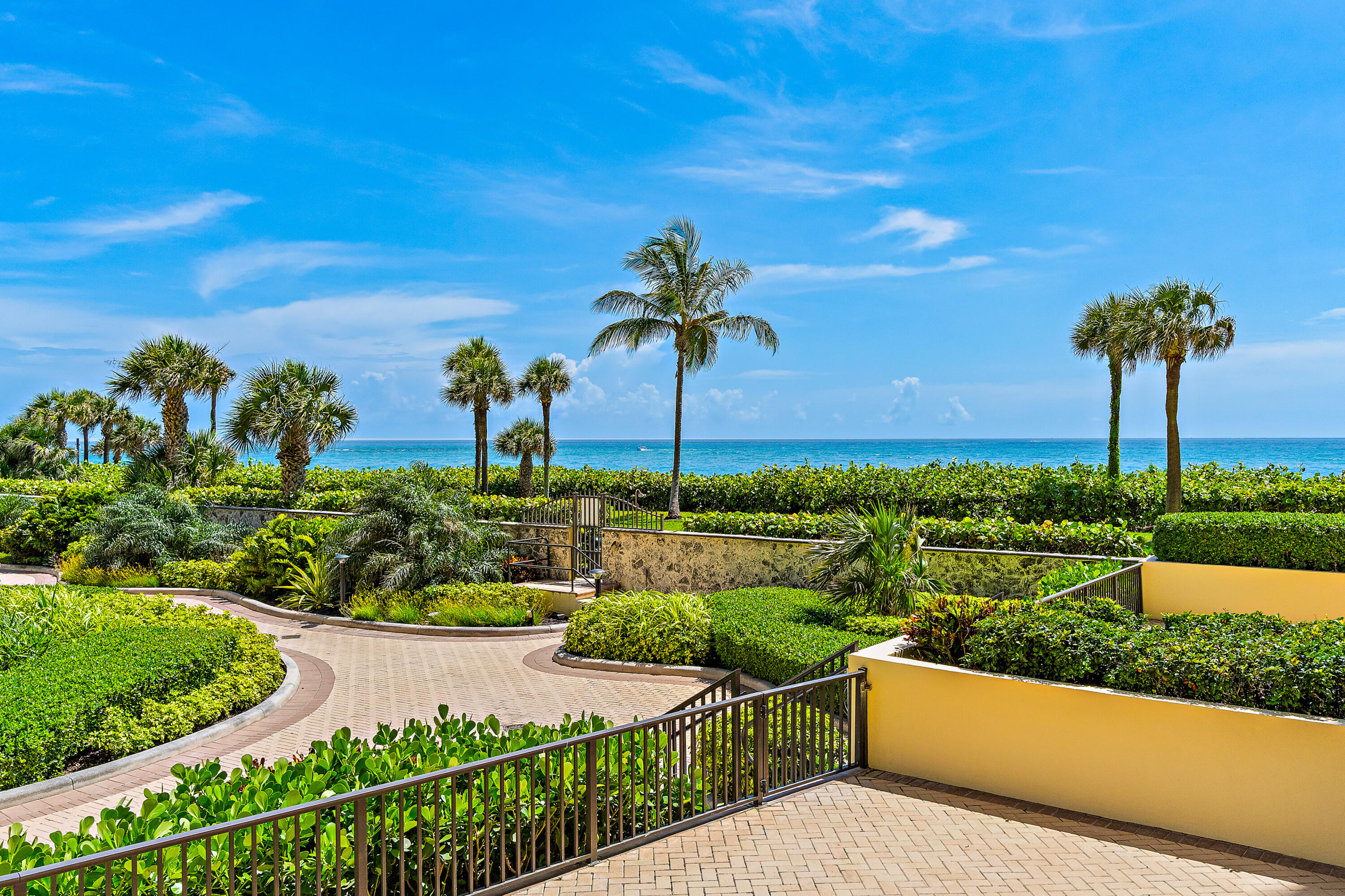 300 Ocean Trail Way, Unit 102 Jupiter, FL 33477 - Photo 3 of 30 a view of a garden with a table and chairs