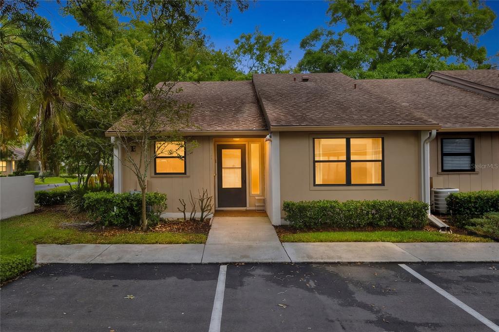 2025 Sylvester Road, Unit E1 Lakeland, FL 33803 - Photo 1 of 37 a front view of a house with garden