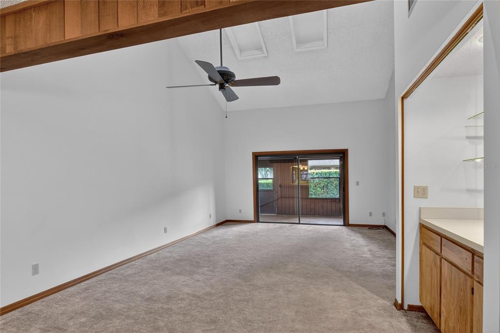 2025 Sylvester Road, Unit E1 Lakeland, FL 33803 - Photo 13 of 37 a view of an empty room with a fireplace and a window