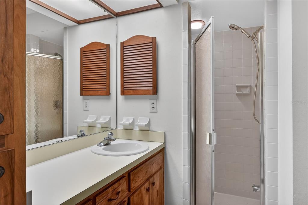2025 Sylvester Road, Unit E1 Lakeland, FL 33803 - Photo 23 of 37 a bathroom with a sink and a mirror