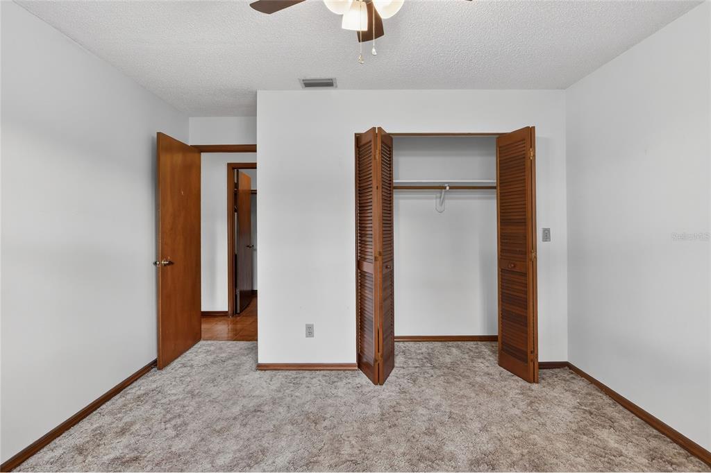 2025 Sylvester Road, Unit E1 Lakeland, FL 33803 - Photo 26 of 37 an empty room with closet