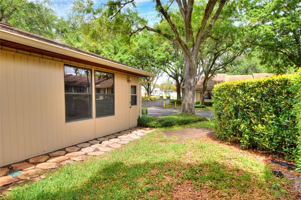 2025 Sylvester Road, Unit E1 Lakeland, FL 33803 - Photo 34 of 37 a view of a backyard with a large tree